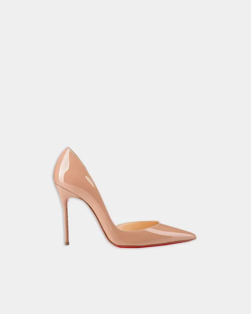 Iriza-inspired patent stiletto pump in nude with pointed toe, side view.