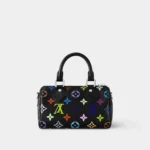 Nano Speedy handbag in black multicolor monogram with black leather trim, front view.