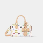 Nano Speedy handbag in white multicolor monogram with natural leather trim, front view.