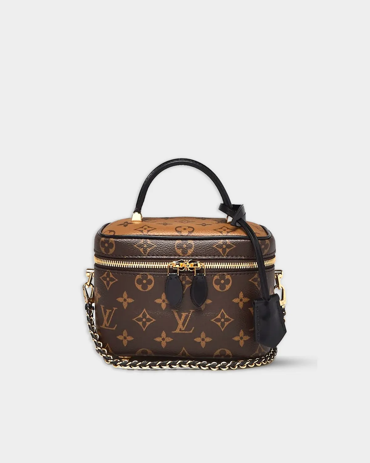 Vanity PM handbag in reverse monogram canvas with black leather trim, front view.
