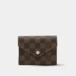 Victorine wallet in damier ebene coated canvas with rose snap closure, front view.