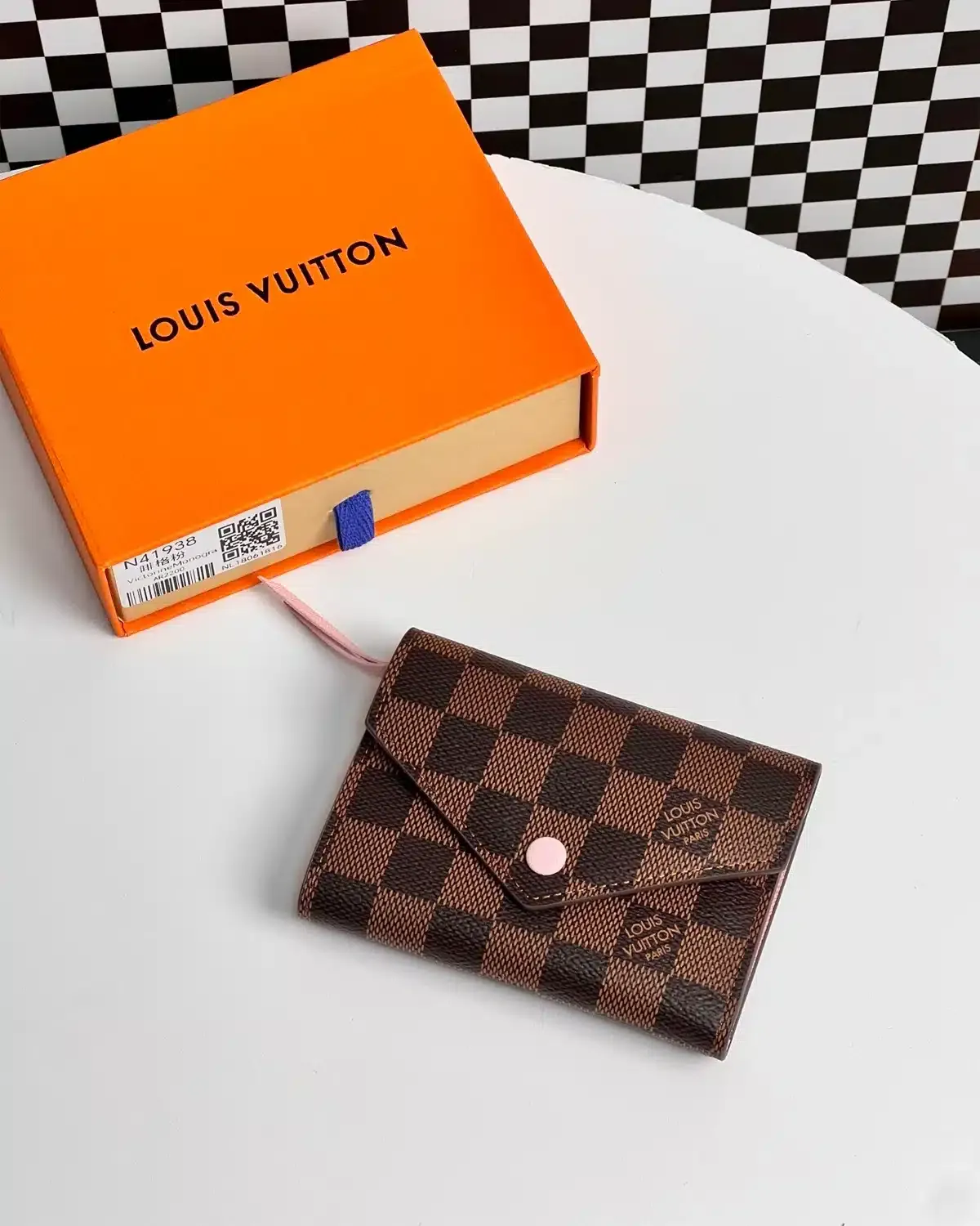 product-louis-vuitton-victorine-tri-fold-wallet-damier-ebene-pink-front-1200x1500-02-tbd