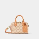Signature Boston Bag 20 in sand toned monogram canvas with wide strap front view
