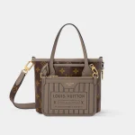 Signature Reversible Mini Tote BB bag showing heritage stamp print front view