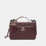 Signature Quilted Vanity Case in burgundy leather with gold chain front view