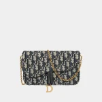 Signature Asymmetrical Chain Pouch Saddle style in blue jacquard front view