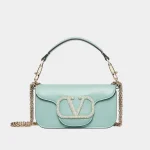 Signature Elongated Shoulder Bag Small in green smooth leather with jeweled logo front view
