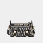 Signature Embroidered Messenger Small bag in blue oblique jacquard front view