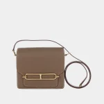 Signature Hinge Clasp Wallet in beige structured leather front view