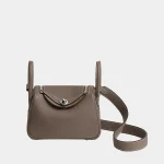 Signature Mini Folded Crossbody bag Lindy style in beige leather front view