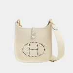 Signature Perforated Messenger Gen III bag in deep blue leather front view