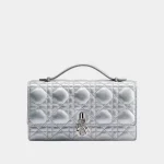 Signature Royal Flap Top Handle Mini bag with sculptural gold metal handle front view