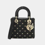 Signature Royal Top Handle Mini bag in black cannage lambskin front view