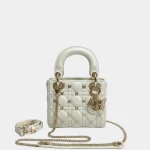 Signature Royal Top Handle Small bag in lambskin with butterfly studs front view