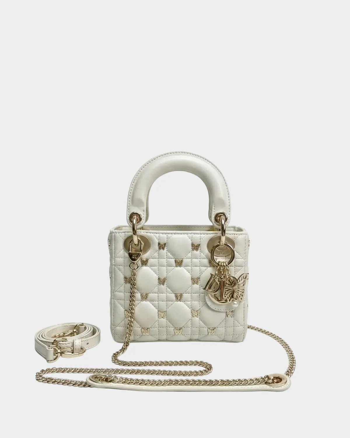 Signature Royal Top Handle Small bag in lambskin with butterfly studs front view