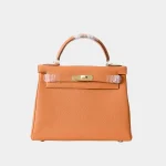 Signature Structured Top Handle 28 Sellier style in Feu orange leather front view