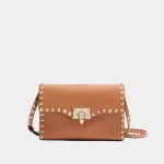Signature Studded Flap Bag Medium in brown grained leather front view