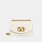 Signature Tonal Logo Shoulder Bag Medium in smooth beige leather front view