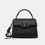 Signature Tonal Logo Top Handle Mini bag in smooth black leather front view